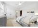 Bright bedroom featuring a neutral palette, plush carpet, and ample natural light streaming through the window at 1328 Palace Garden Way, Raleigh, NC 27603
