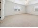 Large, naturally lit bonus room with neutral carpet and multiple windows at 1328 Palace Garden Way, Raleigh, NC 27603