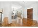 Elegant dining area featuring hardwood floors, white trim, and a decorative chandelier at 1328 Palace Garden Way, Raleigh, NC 27603