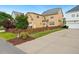 Two-story home with a fenced backyard and well-maintained lawn, showing the side and back of the house at 1328 Palace Garden Way, Raleigh, NC 27603