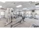 Community gym with cardio equipment, weight machines, and natural light at 1328 Palace Garden Way, Raleigh, NC 27603