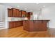 Kitchen boasts wood cabinets, granite countertops, and modern appliances, blending functionality with classic style at 1328 Palace Garden Way, Raleigh, NC 27603