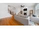 Comfortable living room featuring a fireplace, hardwood floors, and an open staircase at 1328 Palace Garden Way, Raleigh, NC 27603
