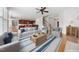 Open-concept living space featuring a ceiling fan, modern furnishings, and seamless flow to the kitchen at 1328 Palace Garden Way, Raleigh, NC 27603