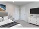 Well-lit bedroom with a dresser, TV, and neutral decor for a comfortable and relaxing space at 1380 Channing Park Cir, Cary, NC 27519