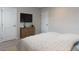 Bright bedroom with a dresser, TV, and neutral decor creating a calm and inviting space at 1380 Channing Park Cir, Cary, NC 27519