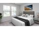 Bright bedroom with large windows, a comfortable bed and neutral decor creating a serene and inviting atmosphere at 1380 Channing Park Cir, Cary, NC 27519