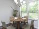 Cozy dining area with wood table, comfortable seating, and natural light at 1380 Channing Park Cir, Cary, NC 27519