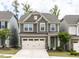 Charming two-story home with a two-car garage and landscaped front yard at 1380 Channing Park Cir, Cary, NC 27519