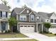 Well-maintained two-story home featuring a two-car garage, lovely landscaping, and inviting curb appeal at 1380 Channing Park Cir, Cary, NC 27519
