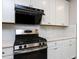 A modern kitchen with stainless steel appliances and white cabinets offering a clean and stylish cooking space at 1380 Channing Park Cir, Cary, NC 27519