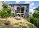 View of backyard with patio, pergola, and screened porch at 1424 Forest Fern Ln, Fuquay Varina, NC 27526