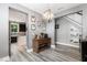 Open-concept dining room with access to the kitchen and staircase, complemented by stylish decor and hardwood floors at 1424 Forest Fern Ln, Fuquay Varina, NC 27526