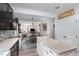 Open-concept kitchen island view of dining and living space in this cozy home at 1424 Forest Fern Ln, Fuquay Varina, NC 27526