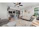 Bright living area with open floor plan, natural lighting, neutral tones, and stylish decor at 1424 Forest Fern Ln, Fuquay Varina, NC 27526