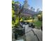 Inviting outdoor patio with a pergola, stone fountain, and comfortable seating area for relaxing or entertaining at 1424 Forest Fern Ln, Fuquay Varina, NC 27526