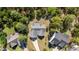 Overhead image showcasing the house's gray roof, surrounding trees, and extended driveway at 15 Clearwater Harbour Hbr, Sanford, NC 27332