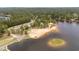 An aerial view of the beach, volleyball court, and lake access at 15 Clearwater Harbour Hbr, Sanford, NC 27332
