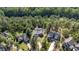 Aerial view of the house, neighboring homes, and extensive surrounding trees at 15 Clearwater Harbour Hbr, Sanford, NC 27332