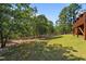 Expansive backyard with lush greenery and mature trees at 15 Clearwater Harbour Hbr, Sanford, NC 27332