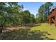 Lush backyard with mature trees offers privacy and a serene setting at 15 Clearwater Harbour Hbr, Sanford, NC 27332