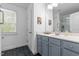 Well-lit bathroom with a single vanity, a large mirror, and a window for natural light at 15 Clearwater Harbour Hbr, Sanford, NC 27332