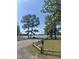 View of park benches and a wooded lake view at 15 Clearwater Harbour Hbr, Sanford, NC 27332