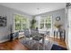 Cozy dining room with bright windows, a stylish chandelier, and hardwood flooring at 15 Clearwater Harbour Hbr, Sanford, NC 27332