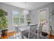 Bright dining room with large windows, pendant lighting, and a door to the exterior at 15 Clearwater Harbour Hbr, Sanford, NC 27332