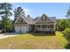Attractive house with a two-car garage, quaint front porch, and lush green yard at 15 Clearwater Harbour Hbr, Sanford, NC 27332