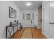Bright foyer with hardwood floors, decorative front door, and stylish console table at 15 Clearwater Harbour Hbr, Sanford, NC 27332