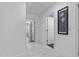 Hallway with marble tile flooring and white doors at 15 Clearwater Harbour Hbr, Sanford, NC 27332