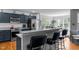 Kitchen bar with seating featuring stainless steel appliances and an open view to the dining area at 15 Clearwater Harbour Hbr, Sanford, NC 27332