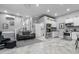 Open living space with a sofa, kitchenette, and access to the staircase at 15 Clearwater Harbour Hbr, Sanford, NC 27332