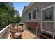 Inviting patio area with wicker furniture, ideal for outdoor dining and relaxing at 15 Clearwater Harbour Hbr, Sanford, NC 27332