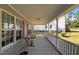 Inviting covered porch with seating, perfect for relaxing and enjoying the outdoors at 15 Clearwater Harbour Hbr, Sanford, NC 27332