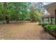 Expansive backyard with mature trees and lush landscaping at 1502 Washington St, Durham, NC 27701