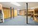 Finished basement area with brick wall and carpet at 1502 Washington St, Durham, NC 27701
