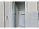 Tiled shower with glass doors and accessible grab bar at 1502 Washington St, Durham, NC 27701