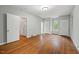 Bright bedroom featuring hardwood floors, natural lighting and two closets at 1502 Washington St, Durham, NC 27701