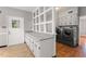 Spacious laundry room boasts gray washer and dryer with storage cabinets and a convenient folding counter at 1502 Washington St, Durham, NC 27701