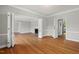 Bright living room features hardwood floors, a fireplace, and neutral paint tones at 1502 Washington St, Durham, NC 27701