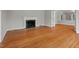 Spacious living room features gleaming hardwood floors and a classic fireplace at 1502 Washington St, Durham, NC 27701