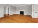 This expansive living room features a fireplace and freshly painted gray walls at 1502 Washington St, Durham, NC 27701