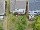 This aerial view showcases homes with patios, decks, and well-kept backyards in a quiet neighborhood at 1605 Silo Point Dr, Wake Forest, NC 27587