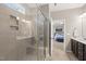 Elegant bathroom with tiled shower and a view into the Primary bedroom at 1605 Silo Point Dr, Wake Forest, NC 27587