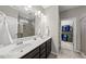 Bathroom with double sink vanity and access to a walk-in closet at 1605 Silo Point Dr, Wake Forest, NC 27587