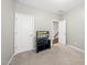 Cozy bedroom features neutral carpet and a TV, offering a comfortable and relaxing space at 1605 Silo Point Dr, Wake Forest, NC 27587