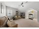 Spacious bonus room features vaulted ceilings, neutral carpet, and comfortable seating area with lots of natural light at 1605 Silo Point Dr, Wake Forest, NC 27587
