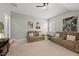 Comfortable bonus room features neutral carpet, and comfortable seating area, with posters and artwork at 1605 Silo Point Dr, Wake Forest, NC 27587